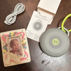Gray Portable Sound Machine HUSHH by yoga sleep + vintage baby frame.